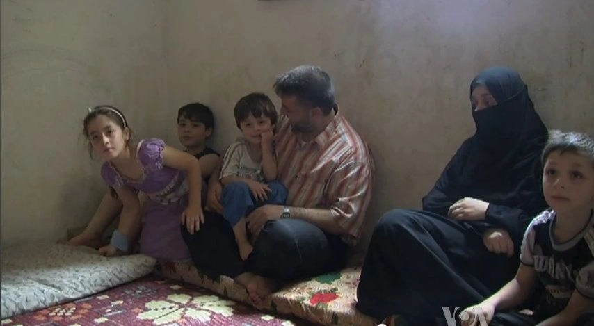 Syrian refugees in Lebanon staying in small cramped quarters. Credit: Voice of America News: Margaret Besheer reports from the northern Lebanese city of Tripoli; "Syrian Refugees Seek Out Smugglers".