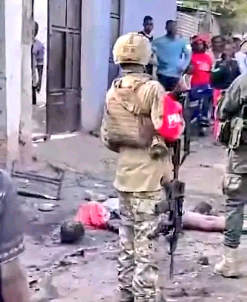 A picture of a young man, shot and killed by M23 forces, laying in the streets of Goma 