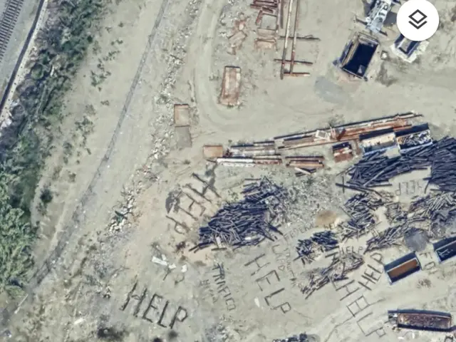 an aerial satellite photo of the help sign at the Los Angeles rail yard