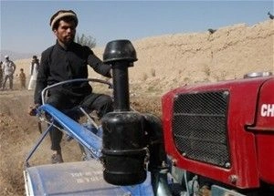Afghan Farmers with insufficiently large tractors producing a wheat surplus