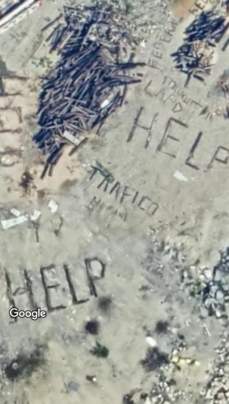 A satellite image depicting "help" messages potentially attributed to human trafficking victims in Los Angeles' Pacific Union Railyard. Courtesy: Google 
