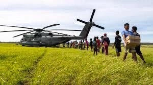 a photo of a helicopter evacuating USAID staffers from a warzone illustrating Humanitarian Aid vs Geopolitics Why USAID is a Political Tool