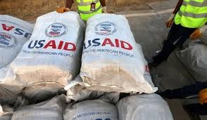 a depiction of USAID aid bags illustrating USAID's Track Record A History of Humanitarian Failures