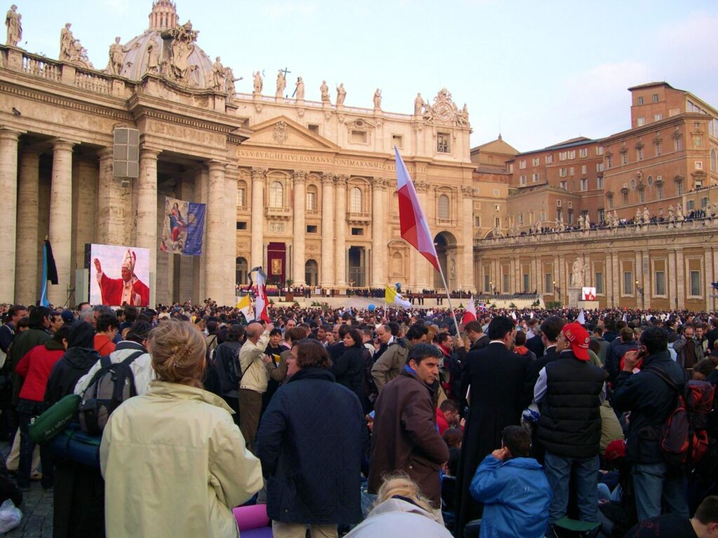 A solemn St. Peter’s Basilica in Vatican City, with black mourning banners after the death of Pope Benedict.