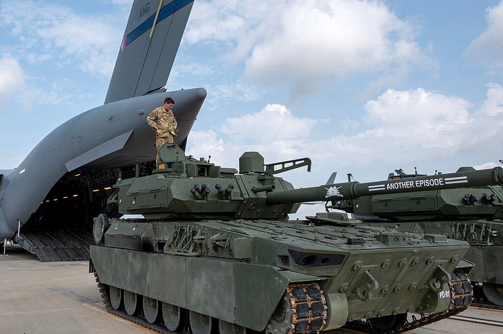 Members of the North Carolina Air National Guard assess an Army M10 Booker Combat Vehicle before it is loaded onto a C-17 Globemaster III aircraft, at the North Carolina Air National Guard base, Charlotte-International Airport, August 3, 2024. Portions of this photo were masked for security reasons. (U.S. Air National Guard photo by Staff Sgt. Reanna Hartgrove)