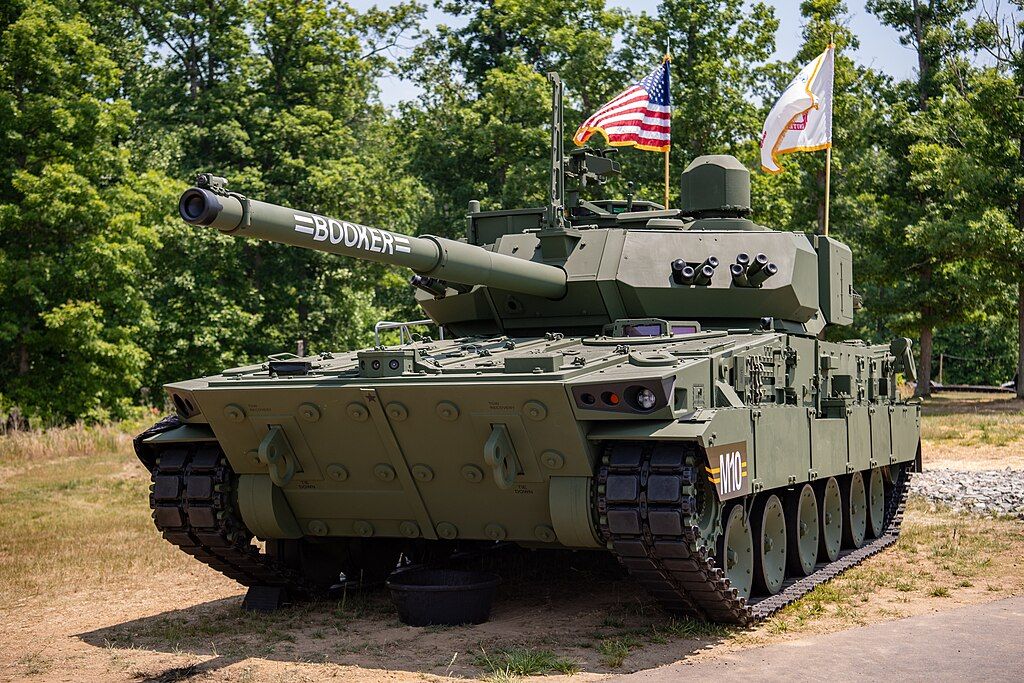 The M10 Booker Combat Vehicle proudly displays its namesake on the gun tube during the Army Birthday Festival at the National Museum of the U.S. Army, June 10, 2023. The M10 Booker Combat Vehicle is named after two American service members: Pvt. Robert D. Booker, who posthumously received the Medal of Honor for actions in World War II, and Staff Sgt. Stevon A. Booker, who posthumously received the Distinguished Service Cross for actions during Operation Iraqi Freedom. Their stories and actions articulate the Army’s need for the M10 Booker Combat Vehicle, an infantry assault vehicle that will provide protection and lethality to destroy threats like the ones that took the lives of these two Soldiers. (U.S. Army photo by Bernardo Fuller)…

