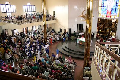 A Catholic congregation at Mass, with younger and older members showing contrasting reactions to Church teachings.