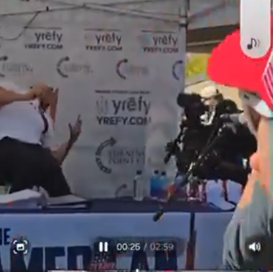 An image depicting the moment at which Charlie Kirk was shot in the neck from an elevated vantage point on September 10, 2025